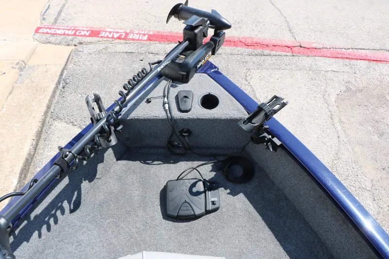 Slide: The Image of 2019 Tracker Pro Guide V-16 WT boat interior with trolling motor and rod holders. - 33