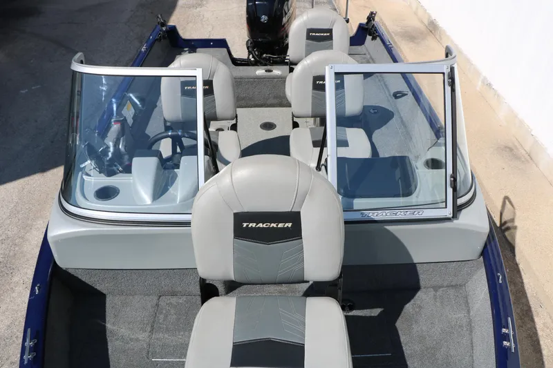 Slide: The Image of 2019 Tracker Pro Guide V-16 WT boat interior with gray seating and windshield. - 35