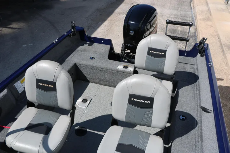 Slide: The Image of 2019 Tracker Pro Guide V-16 WT boat interior with seating and Mercury outboard motor. - 36