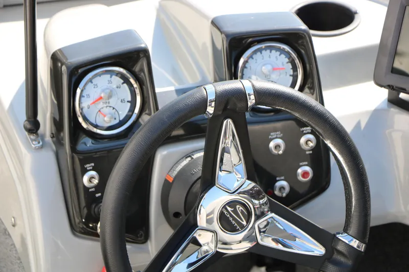 Slide: The Image of Steering wheel and dashboard of 2019 Tracker Pro Guide V-16 WT boat. - 37