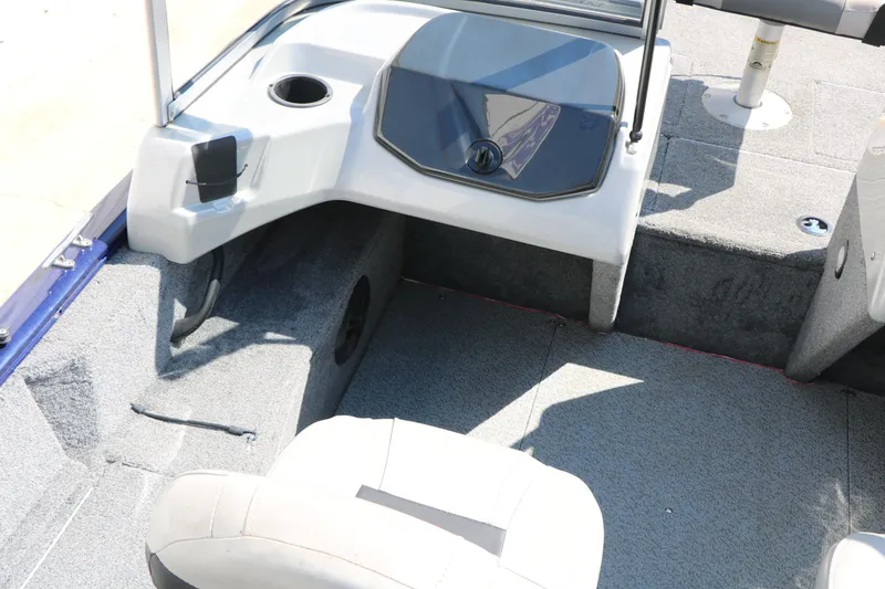 Slide: The Image of 2019 Tracker Pro Guide V-16 WT boat interior with seating and console details. - 38