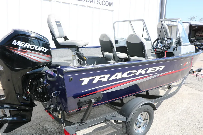 Slide: The Image of 2019 Tracker Pro Guide V-16 WT boat with Mercury FourStroke engine on trailer. - 4