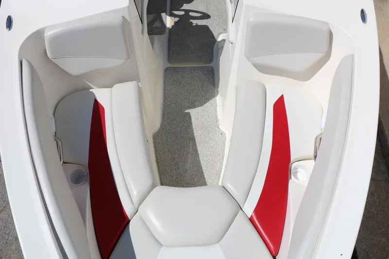 Slide: The Image of 2006 Larson 206 Senza boat interior with red and white seating. - 15