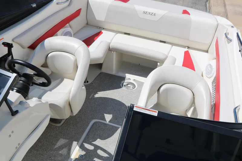 Slide: The Image of Interior of 2006 Larson 206 Senza boat with white and red seating. - 17