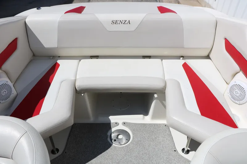 Slide: The Image of 2006 Larson 206 Senza boat interior with white and red seating. - 18