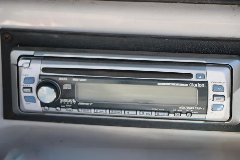 Slide: The Image of Clarion marine stereo system in a 2006 Larson 206 Senza boat dashboard. - 26