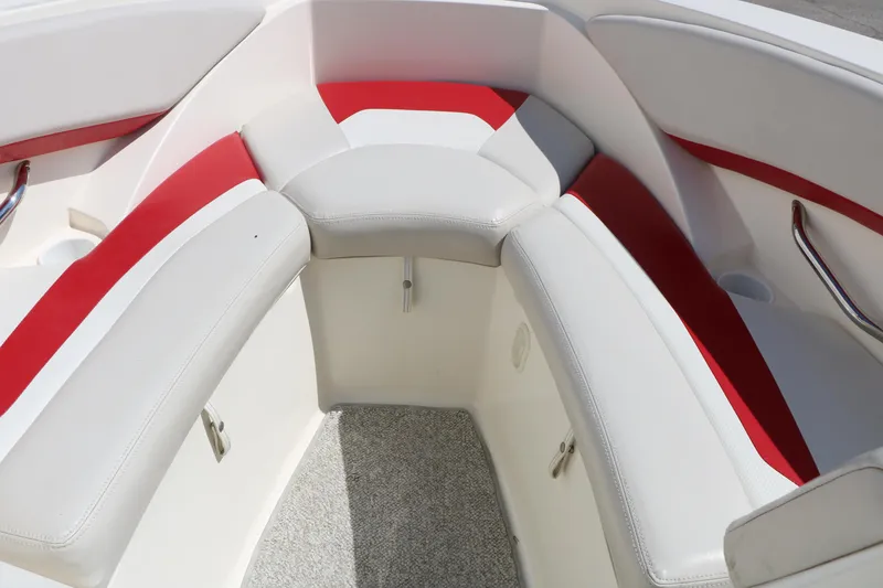 Slide: The Image of Interior seating of a 2006 Larson 206 Senza boat with red and white upholstery. - 27