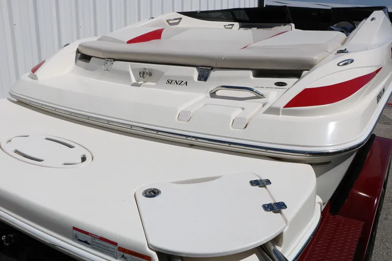 Slide: The Image of 2006 Larson 206 Senza boat rear view with red accents and swim platform. - 7