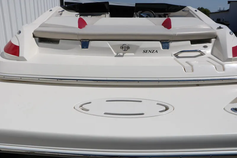 Slide: The Image of 2006 Larson 206 Senza boat rear view with seating and storage compartments. - 8
