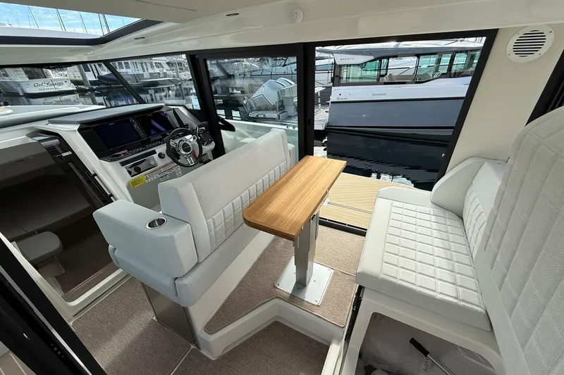 Slide: The Image of 2026 Saxdor 340 GTWA yacht interior view at marina, showcasing sleek design and modern amenities. - 11
