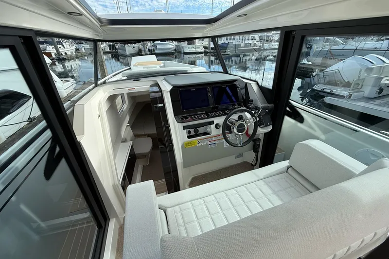 Slide: The Image of Interior of 2026 Saxdor 340 GTWA boat with modern seating and helm. - 12