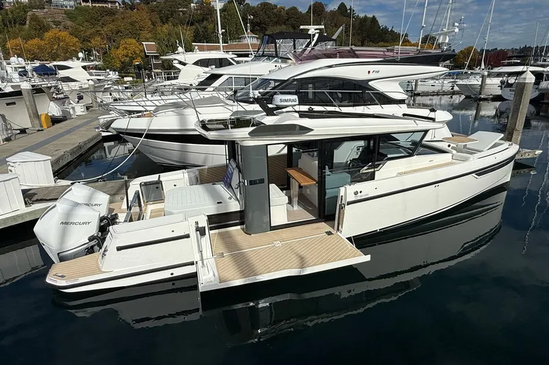 Slide: The Image of 2026 Saxdor 340 GTWA boat side view, docked on calm water. - 5