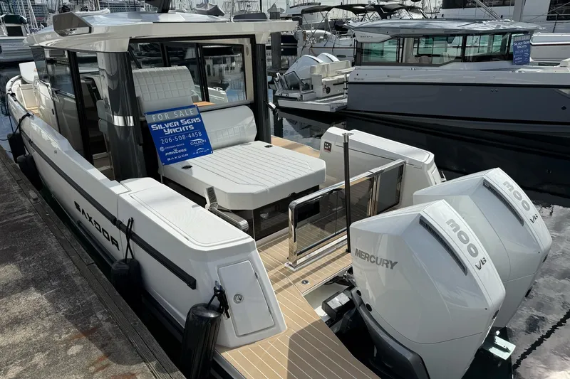 Slide: The Image of 2026 Saxdor 340 GTWA boat docked at marina, featuring sleek design and modern amenities. - 6