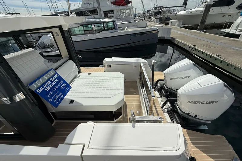 Slide: The Image of 2026 Saxdor 340 GTWA yacht with twin Mercury engines, docked and for sale. - 7