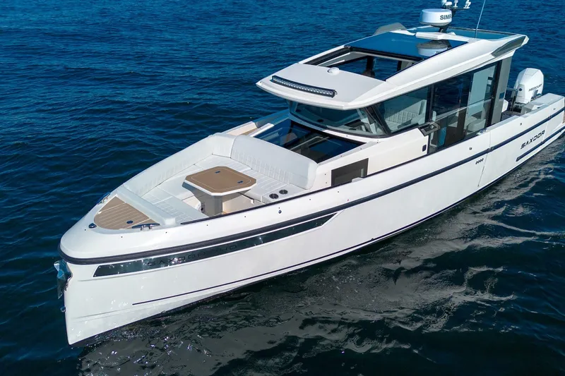 Slide: The Image of 2026 Saxdor 340 GTWA boat cruising on open water, showcasing sleek design and modern features. - 3
