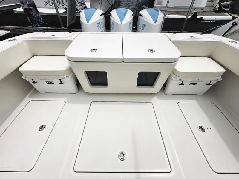 Slide: The Image of 2018 HCB 39 Speciale boat deck with storage compartments and outboard motors. - 15