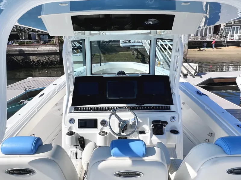 Slide: The Image of 2018 HCB 39 Speciale boat cockpit with modern controls and blue accents. - 19