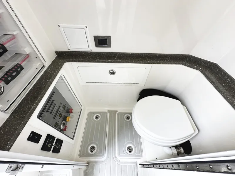 Slide: The Image of 2018 HCB 39 Speciale boat interior with toilet and control panel. - 35