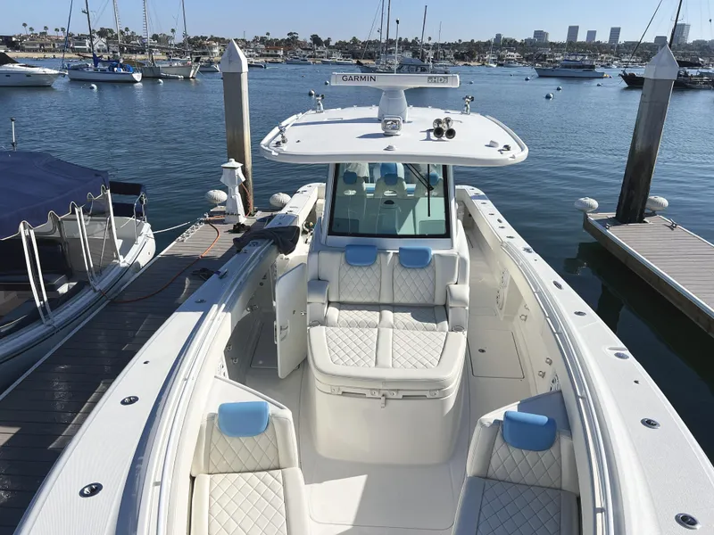 Slide: The Image of 2018 HCB 39 Speciale boat docked in marina, featuring luxurious seating and modern design. - 6