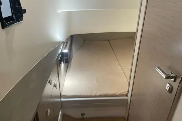 Slide: The Image of 2023 Fjord 38 Xpress cabin interior with bed and storage cabinets. - 10