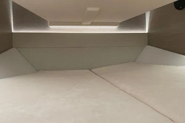 Slide: The Image of 2023 Fjord 38 Xpress cabin interior with modern design and ambient lighting. - 14