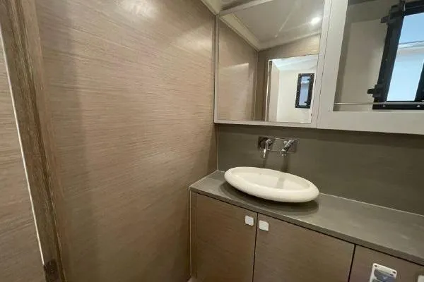 Slide: The Image of 2023 Fjord 38 Xpress bathroom with modern sink and mirror, featuring sleek design. - 17