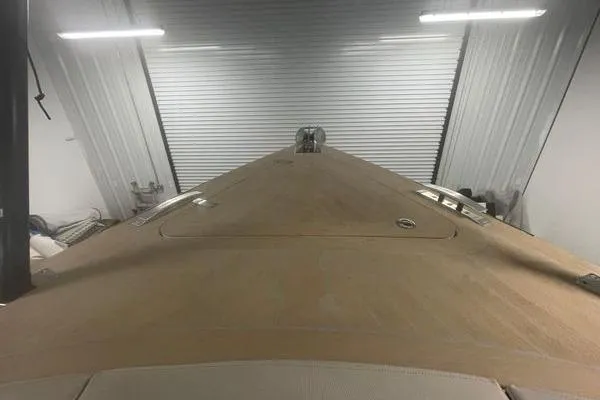 Slide: The Image of 2023 Fjord 38 Xpress boat in storage, viewed from the bow. - 22