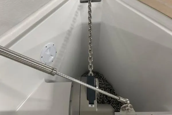 Slide: The Image of 2023 Fjord 38 Xpress anchor chain and mechanism in boat compartment. - 24