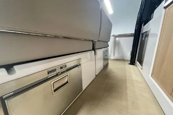 Slide: The Image of Interior view of 2023 Fjord 38 Xpress, featuring sleek storage and modern design. - 28