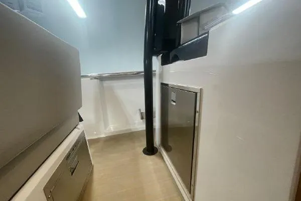 Slide: The Image of Interior view of 2023 Fjord 38 Xpress boat, featuring sleek cabinetry and modern design. - 29