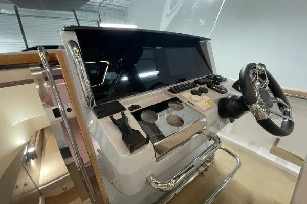 Slide: The Image of 2023 Fjord 38 Xpress helm with modern controls and sleek design. - 33