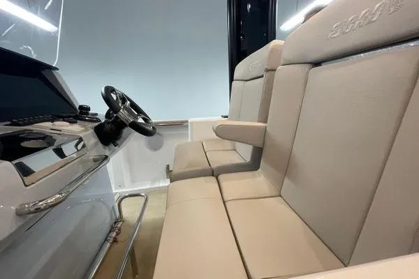Slide: The Image of 2023 Fjord 38 Xpress interior with beige seating and modern steering console. - 34