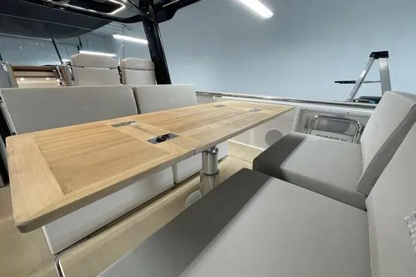 Slide: The Image of 2023 Fjord 38 Xpress interior with sleek seating and wooden table. - 38
