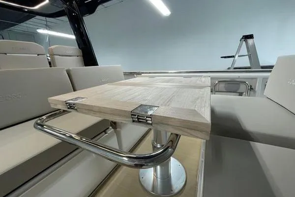 Slide: The Image of 2023 Fjord 38 Xpress interior with sleek seating and foldable table design. - 40