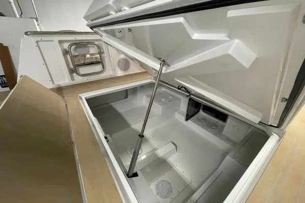 Slide: The Image of 2023 Fjord 38 Xpress storage compartment with open hatch, showcasing spacious interior design. - 41