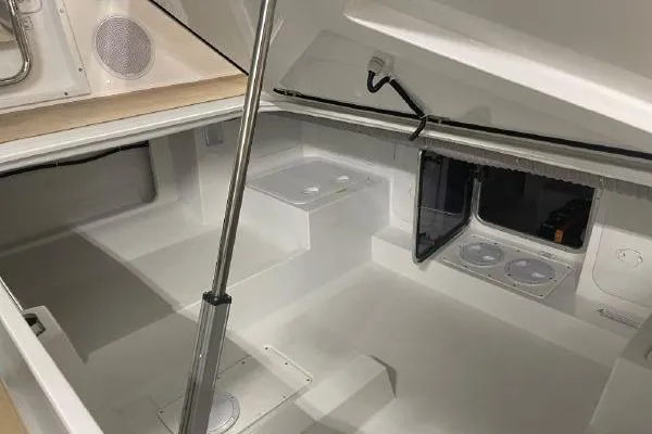 Slide: The Image of 2023 Fjord 38 Xpress interior cabin with modern design and storage compartments. - 42