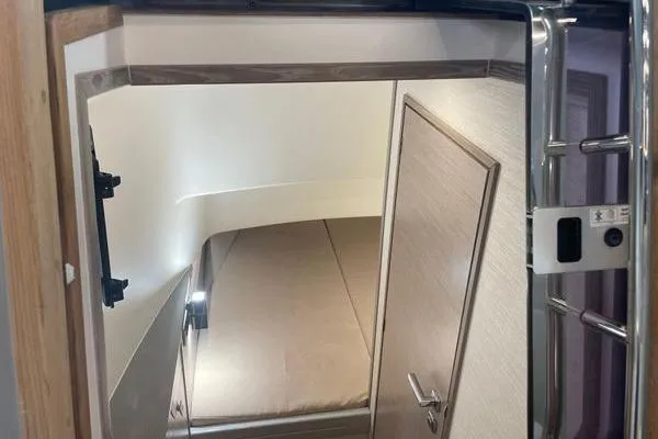 Slide: The Image of Interior cabin of 2023 Fjord 38 Xpress, featuring a cozy bed and modern design. - 9