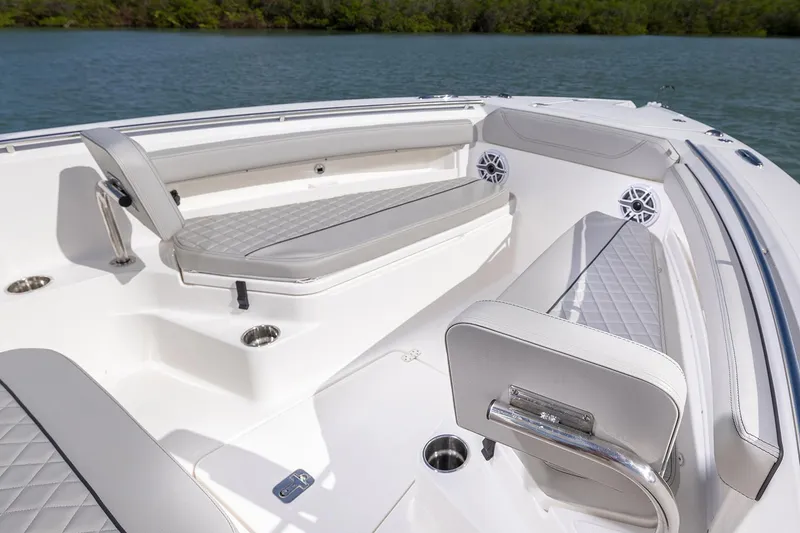 Slide: The Image of Manufacturer Provided Image: 2025 Pursuit S 248 Sport boat interior with cushioned seating and cup holders. - 6