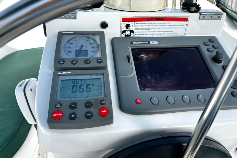 Slide: The Image of Control panel of a 2002 Beneteau 331 sailboat with navigation instruments. - 23