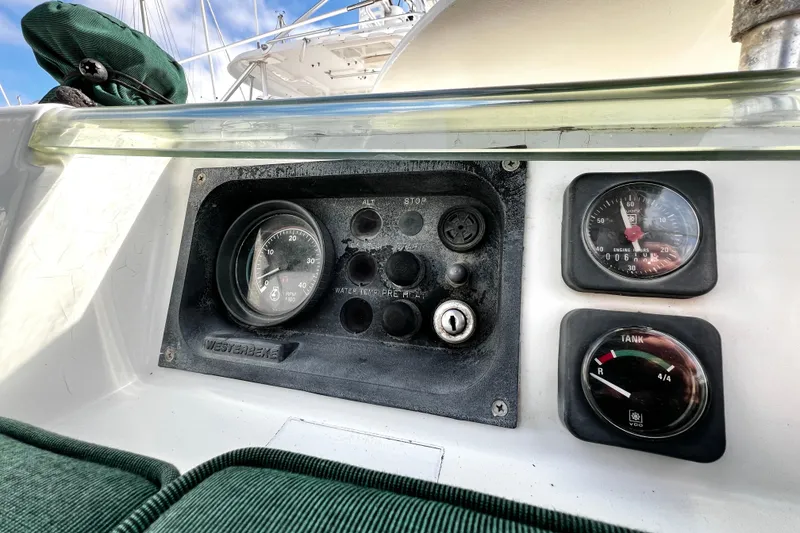 Slide: The Image of Control panel of a 2002 Beneteau 331 sailboat with gauges and switches. - 25