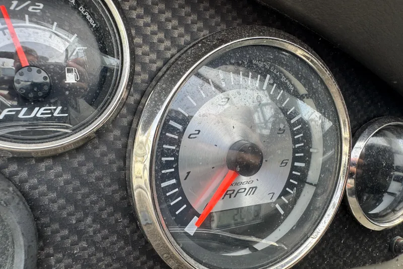 Slide: The Image of Close-up of 2018 Stingray 204 LR dashboard with RPM and fuel gauges. - 3