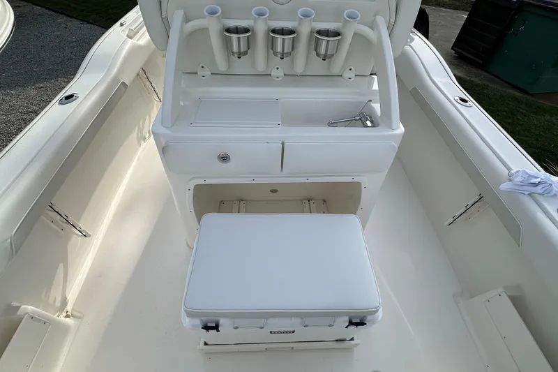 Slide: The Image of 2026 Key West 239 FSR boat interior with seating and rod holders. - 11