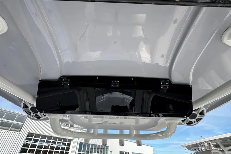 Slide: The Image of 2026 Key West 239 FSR boat roof with mounted speakers and storage compartment. - 18