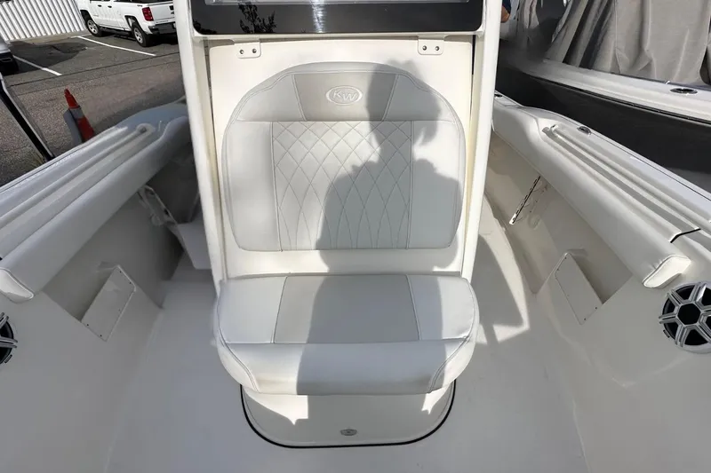 Slide: The Image of 2026 Key West 239 FSR boat interior with white cushioned seating. - 21