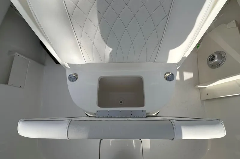 Slide: The Image of Interior view of 2026 Key West 239 FSR boat, featuring white seating and storage compartment. - 22