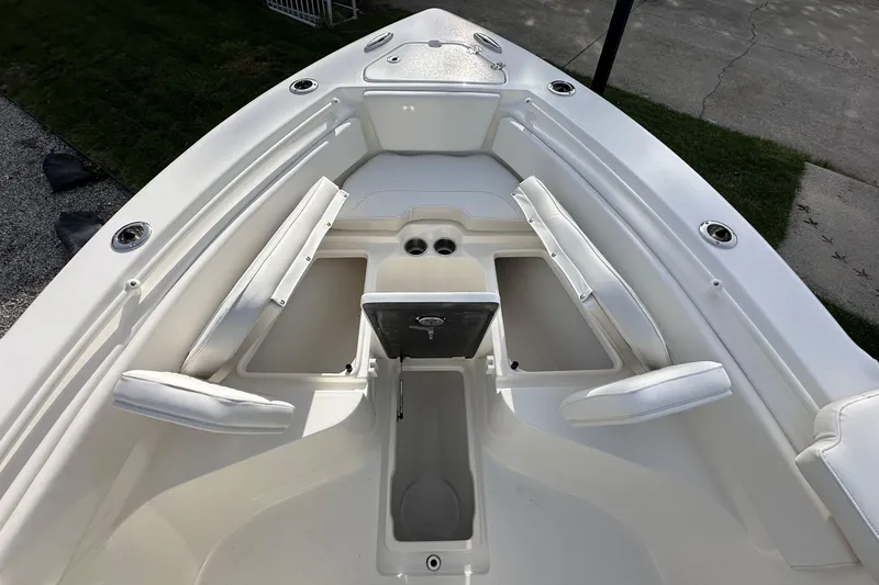 Slide: The Image of 2026 Key West 239 FSR boat interior with seating and storage compartments. - 24