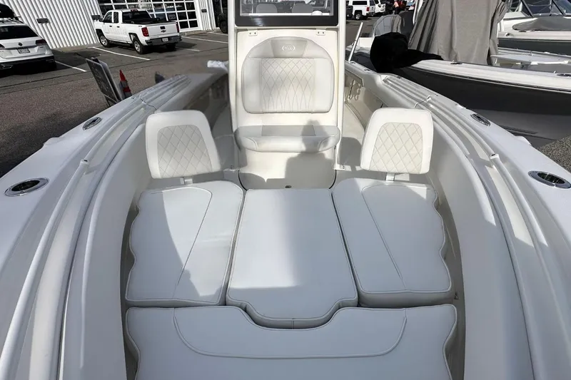 Slide: The Image of 2026 Key West 239 FSR boat interior with white cushioned seating. - 27