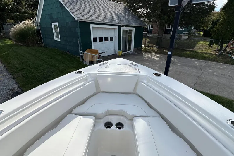 Slide: The Image of Bow view of 2026 Key West 239 FSR boat parked near a green garage. - 30