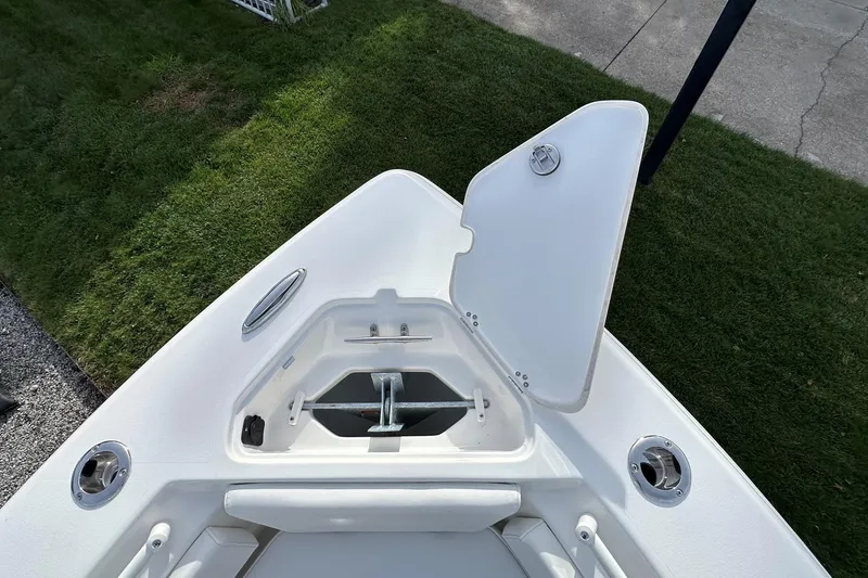 Slide: The Image of Open anchor compartment on 2026 Key West 239 FSR boat, showing anchor storage. - 34