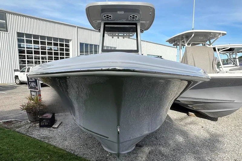 Slide: The Image of 2026 Key West 239 FSR boat displayed outdoors near a service center. - 35